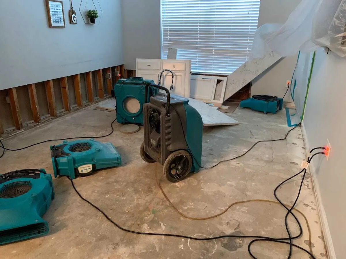 Dehumidifier in flood-cut room for Water Damage Restoration in Wake Forest